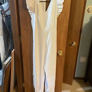 White jumpsuit with ruffled sleeves